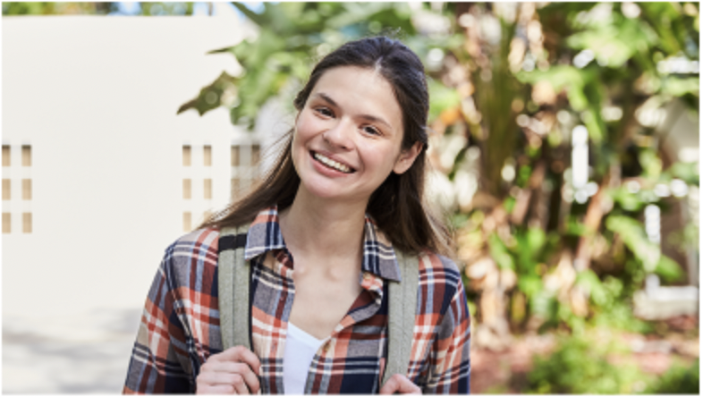 Female student smiling outside